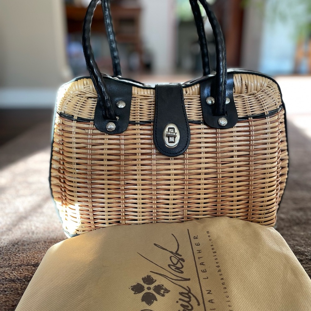 Straw and leather Patricia Nash handbag with dust cover.